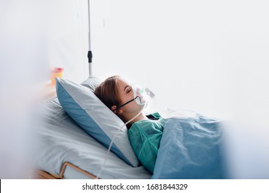 Infected Patient In Quarantine Lying In Bed In Hospital, Coronavirus Concept.