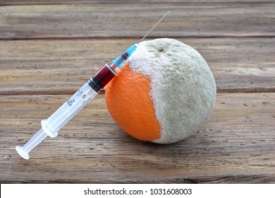 Infected Product With Mold. Syringe For Injection. Penicillin. Spoiled Citrus Orange