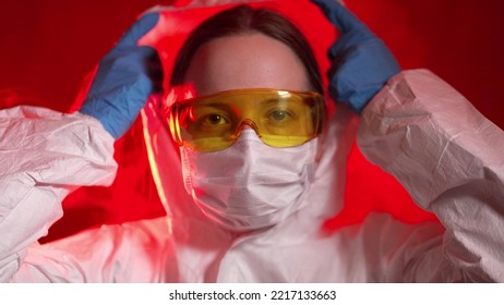 An Infectious Disease Doctor Puts On A Protective Suit And Mask To Work With Infected Patients. Dangerous Coronavirus Epidemic 2019-nCoV.