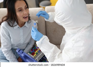 Infectious Disease Doctor Takes Pcr Swab From Patient's Throat On Outpatient Basis. Diagnostics And Treatment Of Covid 19 At Home Concept.