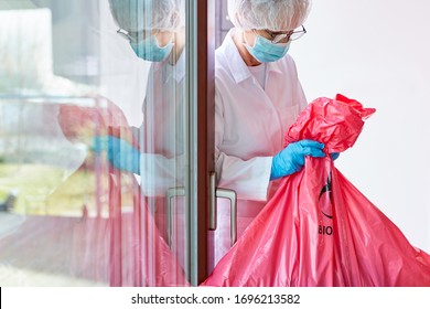 Infectious Hazardous Waste Disposal In Hospital By Cleaning Staff With A Mouthguard In The Case Of A Coronavirus Epidemic