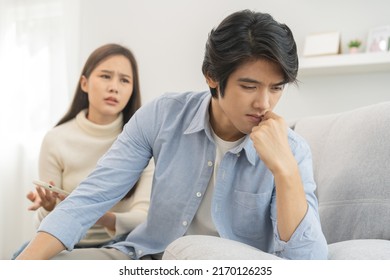 Infidelity, Suspicion Asian Young Couple Love Fight Relationship, Wife Holding Cellphone, Smartphone Cheating On Phone, Scolding Husband About Mistrust, Distrust And Jealousy When Sitting At Home.