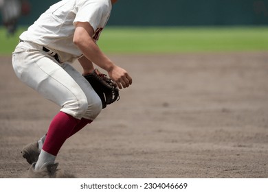 Infielder guarding third base during a baseball game - Powered by Shutterstock