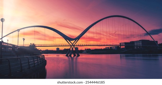 Infinity Bridge on dramatic sky at sunset in Stockton-on-Tees, UK.