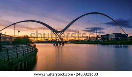 Infinity Bridge on dramatic sky at sunset in Stockton-on-Tees, UK.