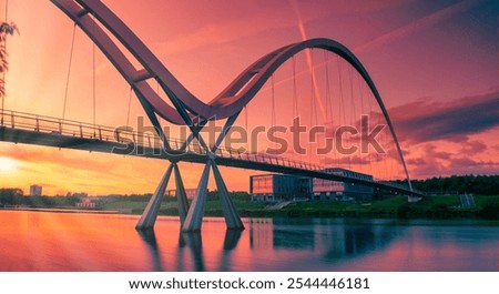 Infinity Bridge on dramatic sky at sunset in Stockton-on-Tees, UK.
