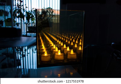 An Infinity Mirror Illusion With LED Candles In It