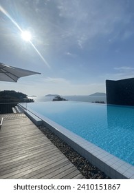 Infinity pool at an angle with sunshine