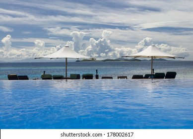 Infinity Pool, Chairs And Umbrellas, Fiji