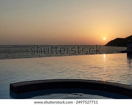 Infinity pool ocean view, sunset, overflow, Greece, Cycladic island Sifnos, rosa rose sun, soft sky reflections sea, water rocks symmetry, romantic, exclusive, luxury, honeymoon, no people, private