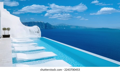 Infinity pool Santorini Greece looking out over the caldera of the Greek Island, luxury vacation, swimming pool Greece Santorini - Powered by Shutterstock