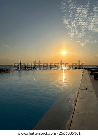 Infinity pool at sunset time 