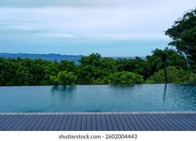 Infinity Pool with Tranquil Nature View Overlooking Lush Tropical Forest and Mountains