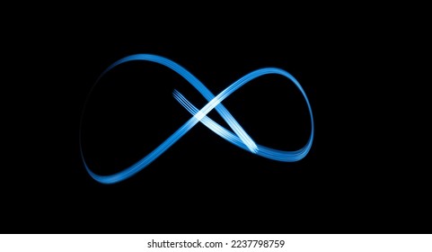 Infinity sign, drawing by light, flash of light in infinity.