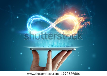 Infinity sign over smartphone, Fire ice sign on blue background.