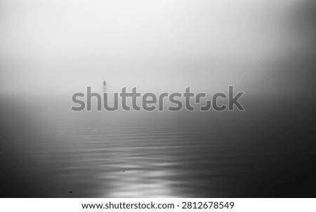 Infinity. Stand up Paddler am Weissensee