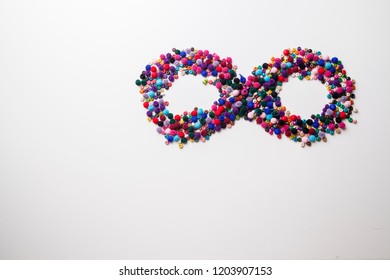Infinity Symbol with colorful beads white background