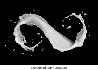 infinity symbol of milk splash isolated on black