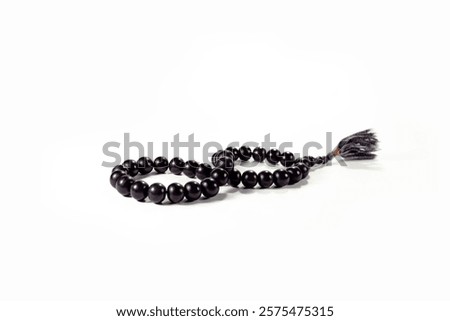 infinity zikir Islamic prayer beads or rosary on a white background. tool for remembrance of Allah in the month of Ramadan