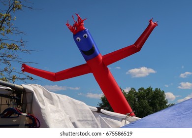 Inflatable Air Dancer Balloon Man On A Beautiful Summer Afternoon.