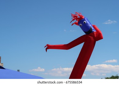 Inflatable Air Dancer Balloon Man On A Beautiful Summer Afternoon.