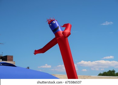 Inflatable Air Dancer Balloon Man On A Beautiful Summer Afternoon.