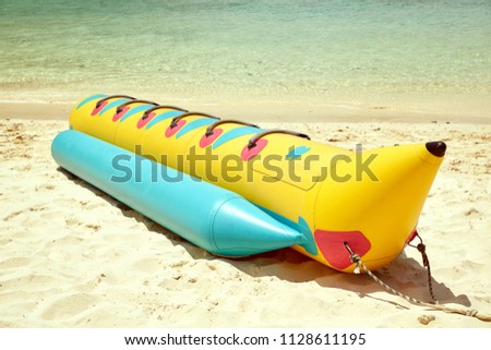Inflatable bananas for group skating on the sea. Active rest, entertainment, attraction on the water.