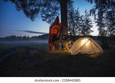 Inflatable boat with a bicycle in a tourist camp - Powered by Shutterstock