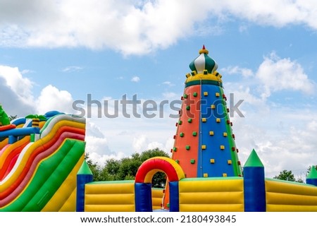Inflatable climbing tower and obstacle course slide for kid games  or team building outdoor activities.