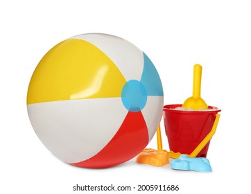 Inflatable colorful beach ball and child plastic toys on white background - Shutterstock ID 2005911686
