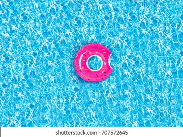 Inflatable colorful donut in swimming pool