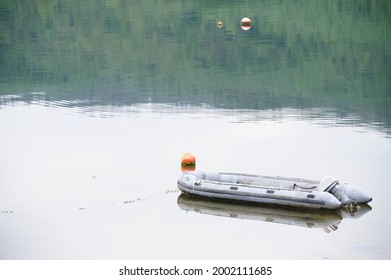 Inflatable dingy life rescue boat moored at marina - Shutterstock ID 2002111685