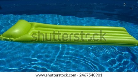 Inflatable lilo in swimming pool