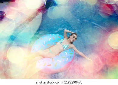 inflatable pool girl hotel girl / rest in a luxury hotel,  beautiful girl in  pool with an inflatable