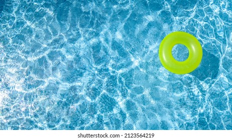 Сolorful Inflatable Ring Donut Toy In Swimming Pool Water Aerial View From Above, Family Vacation Holiday Resort Background