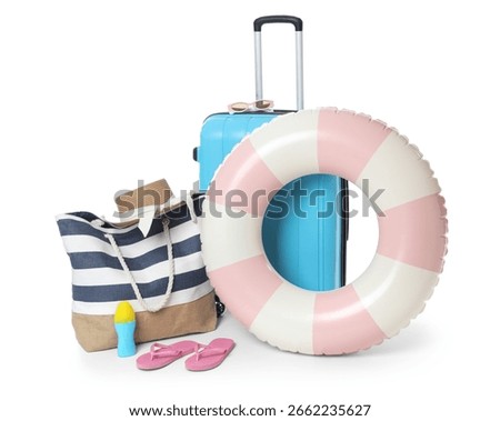 Inflatable ring, suitcase, bottle of sunscreen cream and beach accessories isolated on white background