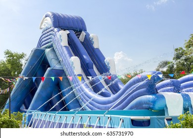 Inflatable Slide Bounce Or Water Sliders At Water Park