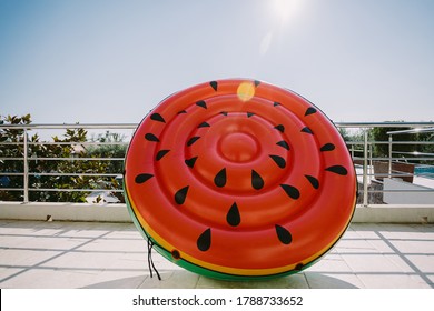 Inflatable Toy Pool Floating Watermelon. Summer Vacation Time With Fun Beach Floaties In Swimming Pool. No People.