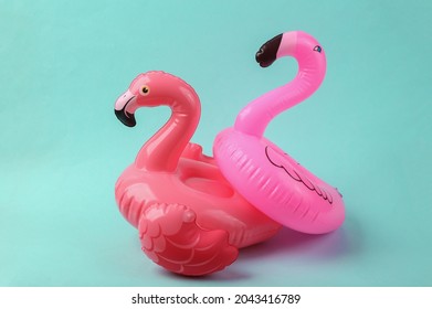 Inflatable two flamingo on blue background. Pool party. Summer concept. Creative layout - Shutterstock ID 2043416789