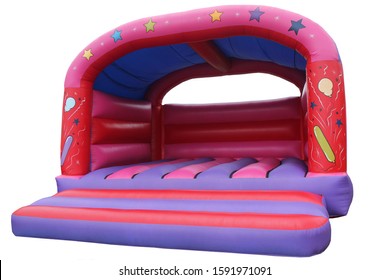 An Inflated Brightly Coloured Bouncy Castle Play Area. - Shutterstock ID 1591971091