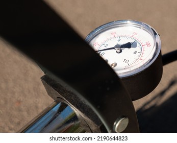 Inflating Bike Tire Outdoors. Pumping Up Bicycle Tyre. Closeup
