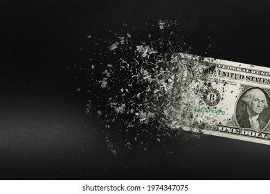 Inflation, dollar hyperinflation with black background. One dollar bill is sprayed in the hand of a man on a black background. The concept of decreasing purchasing power, inflation. - Shutterstock ID 1974347075