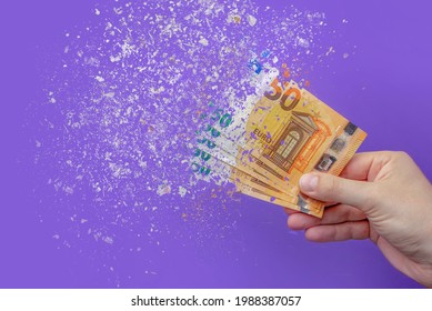 inflation euro . Inflation in Europe, hyper inflation. Banner with purple background. Fifty euro banknotes sprayed in the hand of a man on a purple background. - Shutterstock ID 1988387057