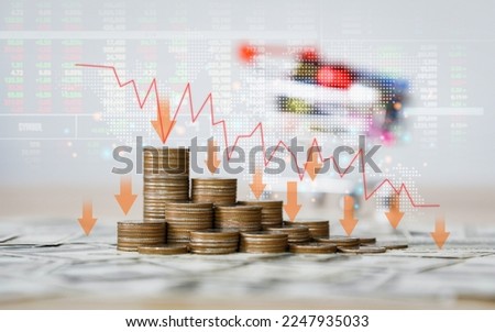 The Inflation and recession of the economy of global.The concept of economic collapse and the collapse of the stock exchange on stacks of coins and a graph arrow pointing down.