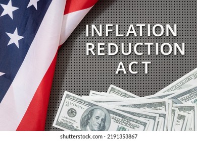Inflation reduction Act law concept. Fat lay of text, american flag and dollar banknotes - Shutterstock ID 2191353867