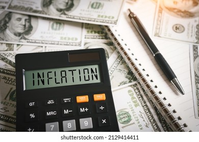 INFLATION word on calculator in idea for FED consider interest rate hike, world economics and inflation control, US dollar inflation - Shutterstock ID 2129414411