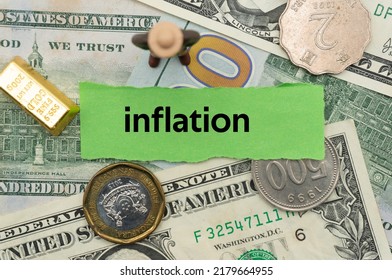 inflation.The word is written on a slip of paper,on colored background. professional terms of finance, business words, economic phrases. concept of economy. - Shutterstock ID 2179664955