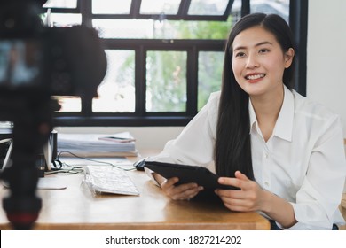 Influencer and content creator in digital marketing concepts. Young woman arecord video content to her channel. - Shutterstock ID 1827214202