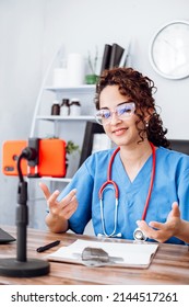 Influencer Female Doctor Using Her Phone Making A Video, Social Media And Trends Concept.