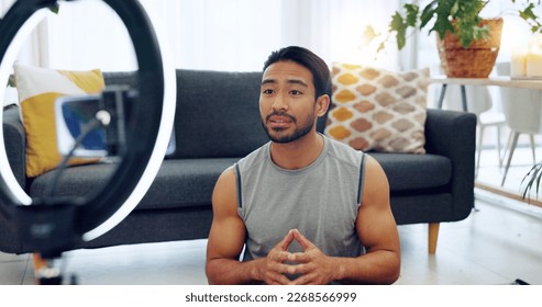 Influencer, fitness and training with a sports man live streaming or recording content for his social media or subscription service viewers. Health, motivation and workout with a personal trainer - Powered by Shutterstock